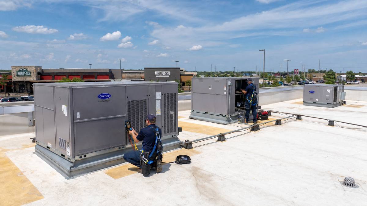 ARP Heat And Air technicians servicing commercial rooftop HVAC units — Oklahoma City metro
