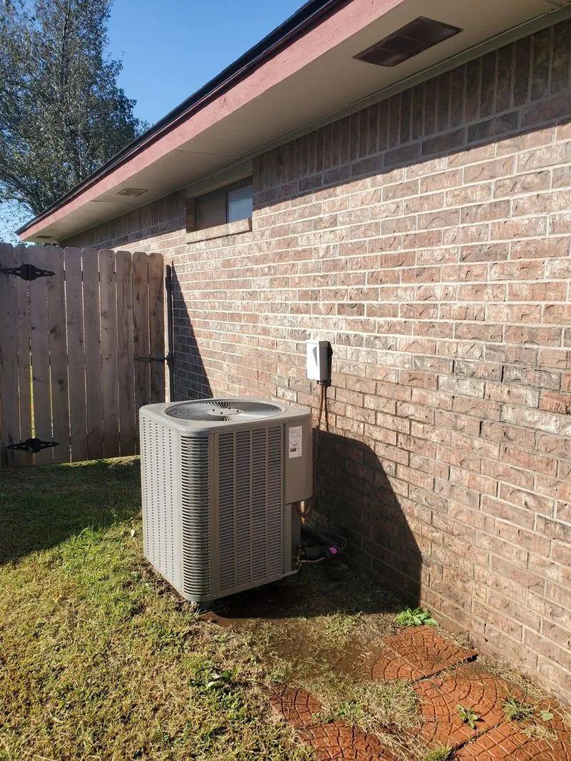 AC condenser unit installed at Oklahoma residence by ARP Heat And Air